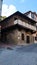 medieval house half timbered wood stone corner street & x28;Ozzano& x29; Italy