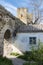 Medieval house, wall and tower of Genoese fortress in the city of Feodosia on the Crimean Peninsula, built by colonists from Genoa