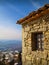 Medieval house with window with beautiful landscape background, San Marino