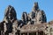 Medieval Khmer Bayon Temple\\\'s majestic stone towers standing against a clear blue sky in Cambodia