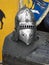 Medieval knight`s helmet with chain mail on a wooden box