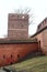 Medieval leaning defence tower of Torun over white sky