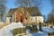 Medieval Lutheran Church in the old city cemetery Sunny February day. Halikko, Finland