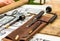 Medieval medical tools, a traditional healer inventory carrying out surgical operations on a wooden background