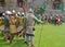 Medieval men at arms preparing for combat.