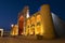 Medieval  Mir-i-Arab  madrasah in colorful night accent lighting. Bukhara