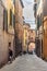 Medieval narrow street Via Giovanni Dupre in Siena, Tuscany, Italy