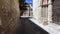 Medieval neighborhood in Baeza, alleyway with stone arch, Jaen province, Andalusia, Spain