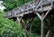 Medieval oak wood, bolted. Bridge over the moat. the railing is made of massive beams, between which several thin oak rods are wov