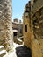 Medieval passage, stone wall with a vintage lantern, Saint-Montan, South of France