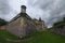 Medieval Pidhirtsi Castle at cloudy summer day, several minutes before rain. Village Pidhirtsi, Lviv region, Ukraine.