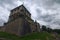 Medieval Pidhirtsi Castle at cloudy summer day, several minutes before rain. Village Pidhirtsi, Lviv region, Ukraine.