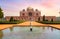 Medieval red sandstone medieval architecture Humayun Tomb complex Delhi at sunset.