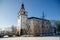 Medieval renaissance water castle with half-timbered tower with snow in winter sunny day, Historic Romantic chateau Blatna near