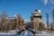 Medieval renaissance water castle with half-timbered tower with snow in winter sunny day, Historic Romantic chateau Blatna near