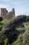 Medieval Ruins of Puglia\\\'s Defensive Wall in Italy: Stock Photo of a Former Crenellated Tower