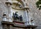 Medieval scene fixed in iron on the facade in city center of Valencia, Spain