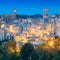 Medieval Sorano town in the evening night with old tradition buildings and illumination. Tuscany, Italy