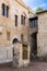 Medieval square with a well for residents of neighboring houses in San Gimignano, Italy