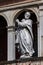 Medieval statue of Saint Peter with a hatchet in his head