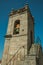 Medieval steeple made of stone with bell and staircase