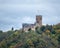 Medieval stone Lahneck Castle surrounded by huge forest,  Lahnstein, Germany