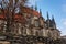 Medieval stone St. BartholomewÂ´s Church, Gothic Cathedral and baroque building of Ossuary in autumn day, arched windows, chimeras