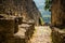 Medieval stone wall of castle of notorious Marquise de Sade in Lacoste, Provence, France. Ruins of old castle in Europe in hot