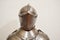 Medieval strong knight warrior chained in iron silvery strong metal armor with a helmet and a visor