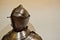 Medieval strong knight warrior chained in iron silvery strong metal armor with a helmet and a visor