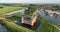 Medieval stronghold castle restored heritage culture monument for touristic museum purpose. Aerial overhead view. Dutch