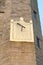 Medieval sundial on stone castle tower UK England