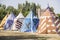 medieval tents next to a field of fair or mourning between warriors