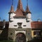 Medieval tower gate with coat of arms