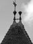 Medieval tower peak with tiled roof in black and white