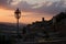 Medieval town and streetlamp by sunset