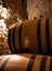Medieval underground wine cellars with old red wine barrels for aging of vino nobile di Montepulciano in old town Montepulciano in