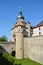 Medieval wall at the Marienberg castle with a bridge in Wuerzburg with blue sky