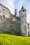 Medieval wall and tower with clock