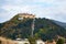 Medieval walled city Rasnov on hill, Romania. Autumn landscape with Medieval fortification Castle