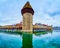 Medieval Water Tower Wasserturm and wooden covered bridge Kapellbrucke, on March 30 in Lucerne, Switzerland