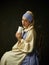 Medieval Woman in Historical Costume Wearing Corset Dress and Bonnet.