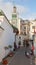 Medina area in Tangier, Morocco. People are walking on narrow street