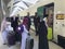 MEDINA, SAUDI ARABIA - MAY 27, 2019 :  a group of Muslim family ready to embark train coaches at HSR Madinah station in Medina,