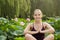 Meditating beautiful woman with hands kept in touch in lotus gar