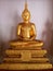 Meditating Buddha image, golden yellow illuminated