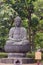 Meditating Buddha statue at Senso-ji Buddhist Temple.