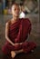 Meditating Buddhist novice in Yangon, Myanmar.