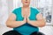 Meditating overweight woman