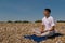 Meditating on a stony beach